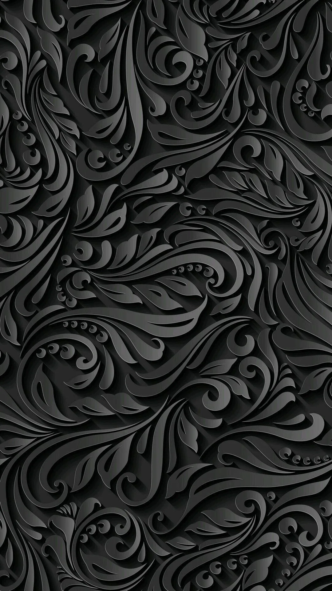 Raised floral scrolls repeat all the way down a tall grey-black panel, each curl edged with a highlight where it lifts off the surface.