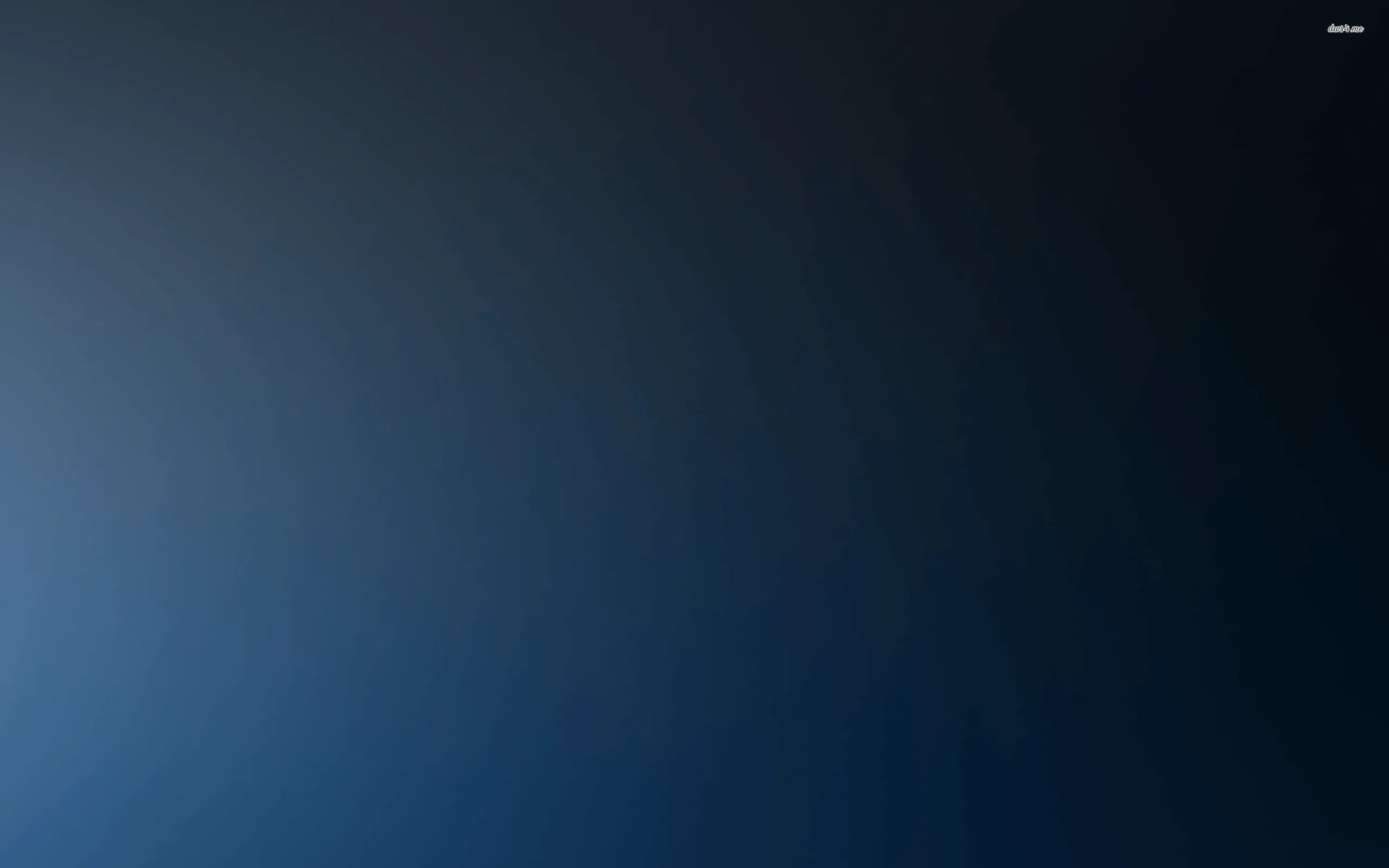 A quiet blend of charcoal and slate blue, faintly brighter toward the upper left, with no detail anywhere to fight desktop icons or a busy dock.