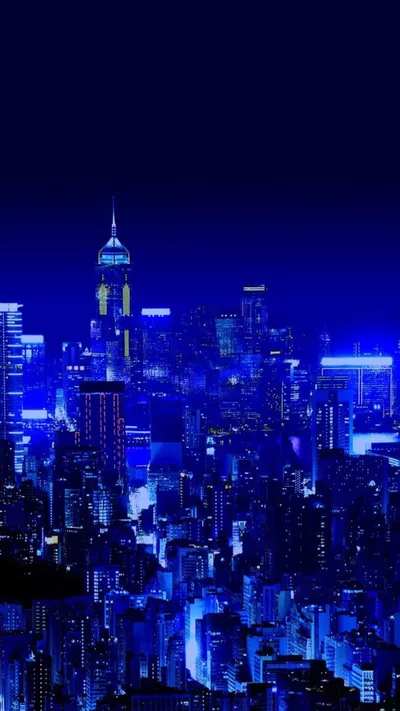High rise towers glow in a single shade of royal blue beneath a sky that deepens to near black, keeping the status bar area dark.
