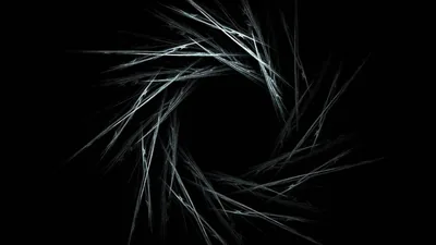 Fine white filaments curl into a broken ring at the centre of the frame, the middle left completely empty.