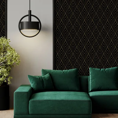 Gold Art Deco arches repeat on black panels behind an emerald green sofa, a ring pendant lamp hanging in the upper left.