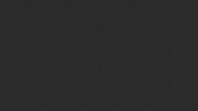 An even charcoal surface with a fine canvas weave running through it, no pattern or focal point anywhere.