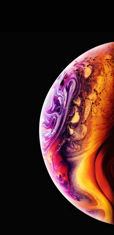 Half a marbled sphere pushes in from the right in orange, gold and violet, the left side of the frame kept clear.
