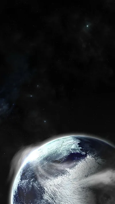 The blue curve of Earth fills the bottom of a tall frame, cloud and ocean lit from the left, the rest given over to faint stars.