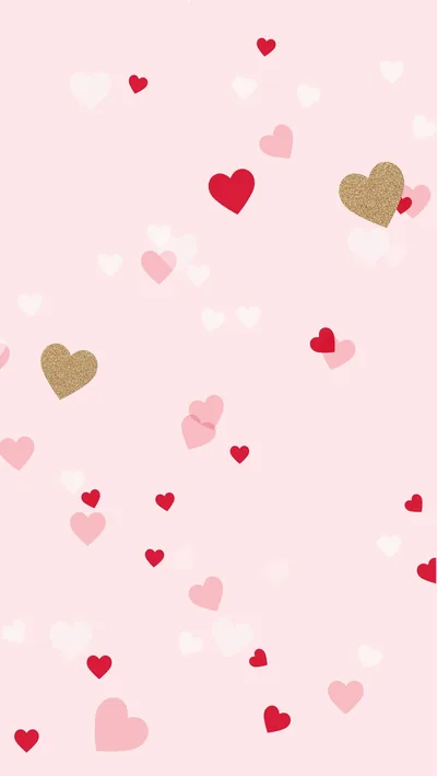 Red, gold and blush hearts scatter loosely over pale pink, a light pattern where a white clock would struggle but dark icons read fine.