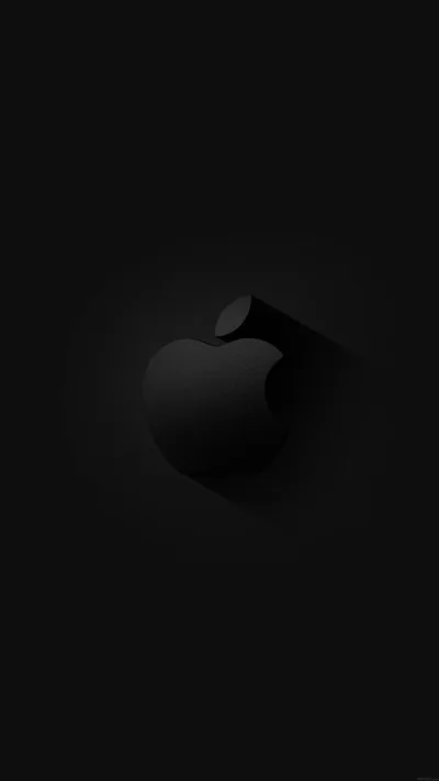 The Apple mark sits raised on a black panel, a soft ring of light behind it and the corners dropping away to nothing.