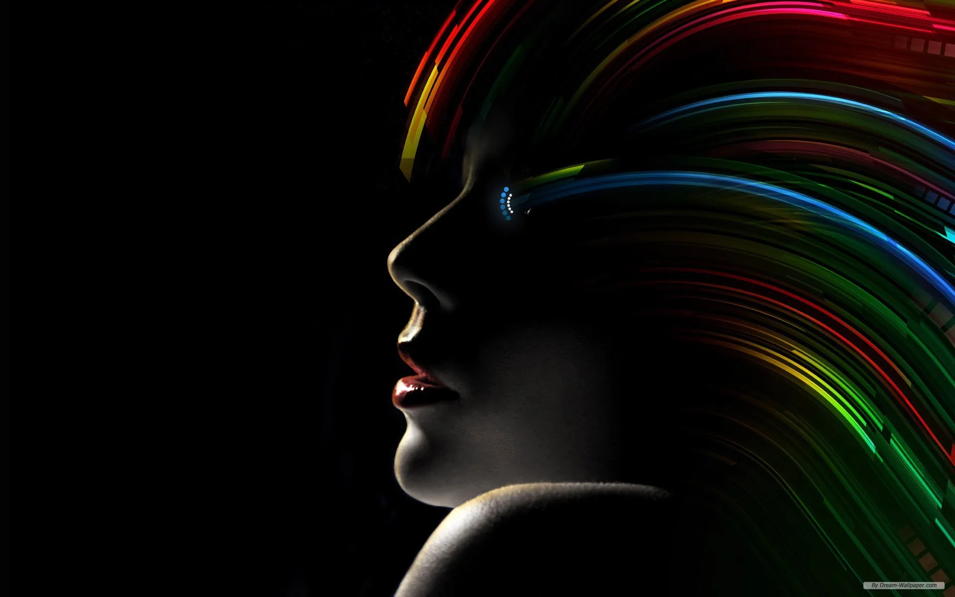 A profile turned to the left in near silhouette, red lips just catching light, while ribbons of green, orange and violet stream back from the head.