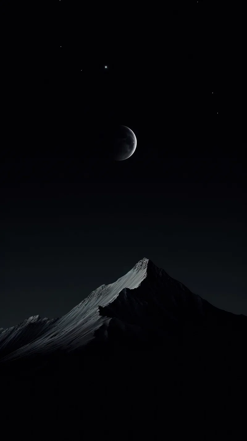 A thin crescent sits high over a single lit mountain ridge, the slopes below and the sky around it dropping into black.