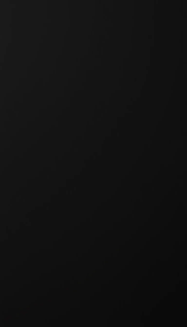 An unbroken black gradient down a tall frame, a faint sheen sliding across the upper left corner and nothing else to compete with app icons.