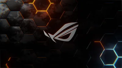 The ROG eye glows white at the centre of a dark hexagon wall, with amber panels top left and cool blue ones bottom right.
