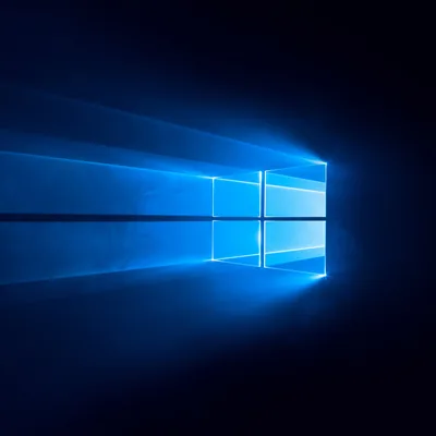 The glowing blue window mark throws hard beams across a square frame, a single dark seam cutting horizontally through the middle.