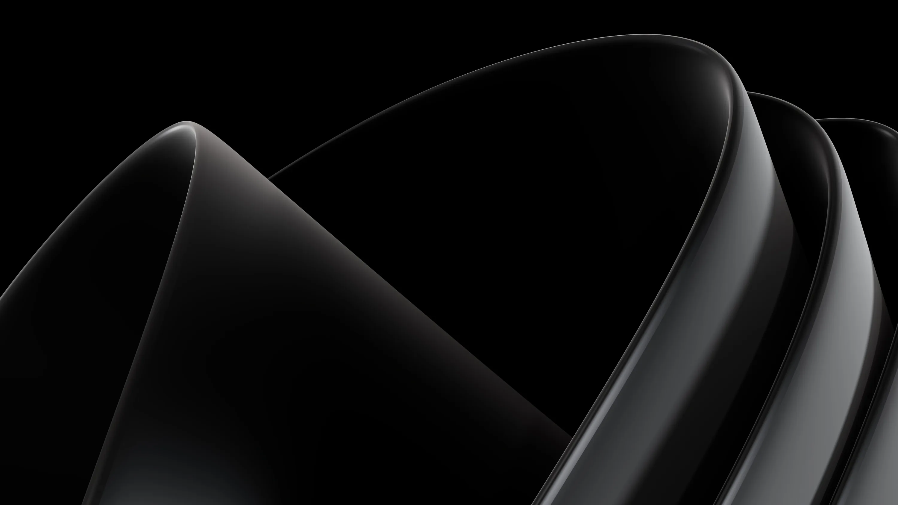 Polished black surfaces fold over one another, catching a single light source along each ridge.
