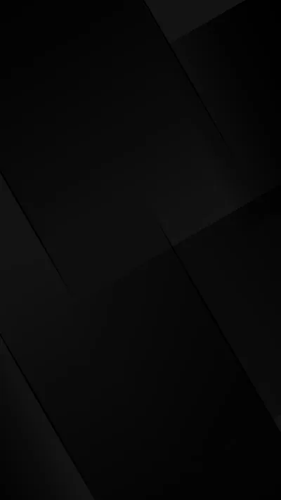 Angled dark panels overlap across the frame, thin lighter seams marking where each plane meets the next.