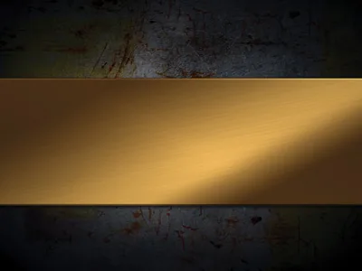 A brushed gold panel runs straight across the middle of a scratched, rust-stained steel plate, the highlight sweeping down it from the upper right.