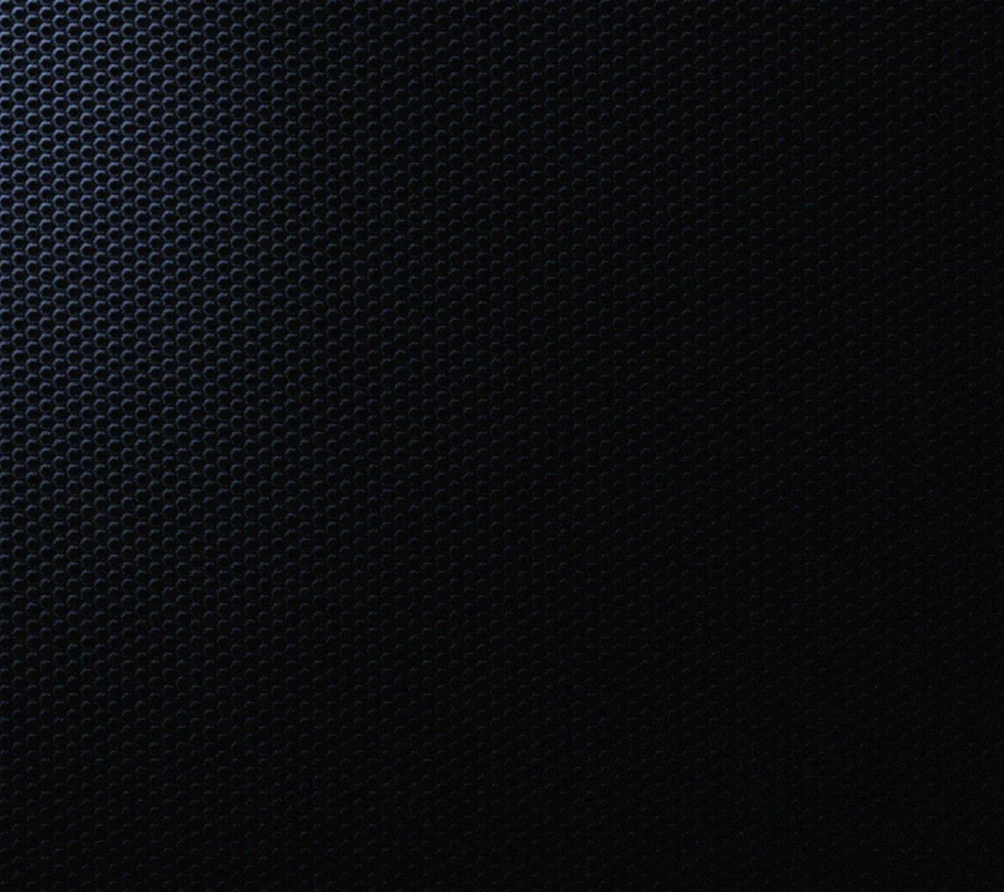 A honeycomb of punched holes fills the frame, cool blue light spilling in from the top left and the lower right lost to shadow.