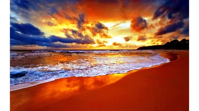 An HDR-style shot pushes the sand to glowing amber and the clouds to deep blue and orange, the smooth foreground leaving room for app icons.