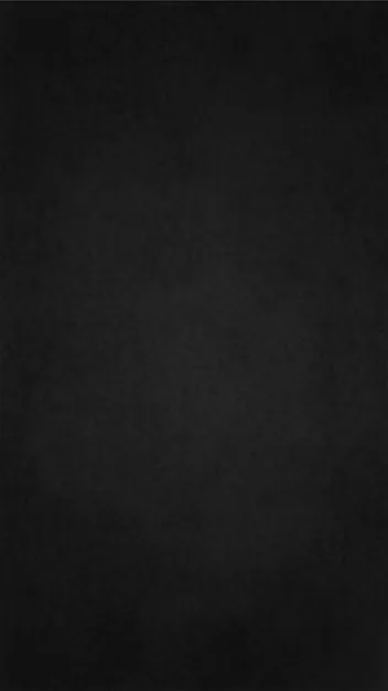 A matte slate surface with faint chalk dust smudged across it, slightly lighter down the centre of a tall portrait frame.