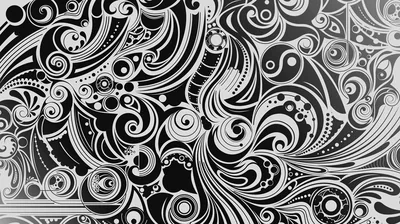 Curling paisley and spiral motifs fill the whole frame in fine white line work over black, with no quiet space left.