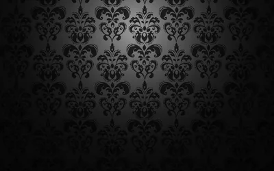 Large crowned damask motifs run in vertical columns over black, the pattern silvered through the upper middle and dropping to nothing along the bottom.