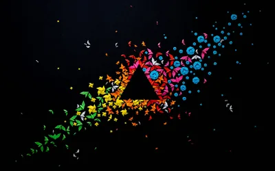 A triangle outline made of butterflies and small circles sits at the centre, the swarm scattering diagonally toward the upper right in yellow, red and blue.