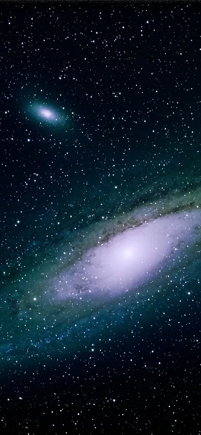 Tall framing of the Andromeda galaxy in a green-tinted sky, its small companion floating above — the core sits low, well clear of the status bar.