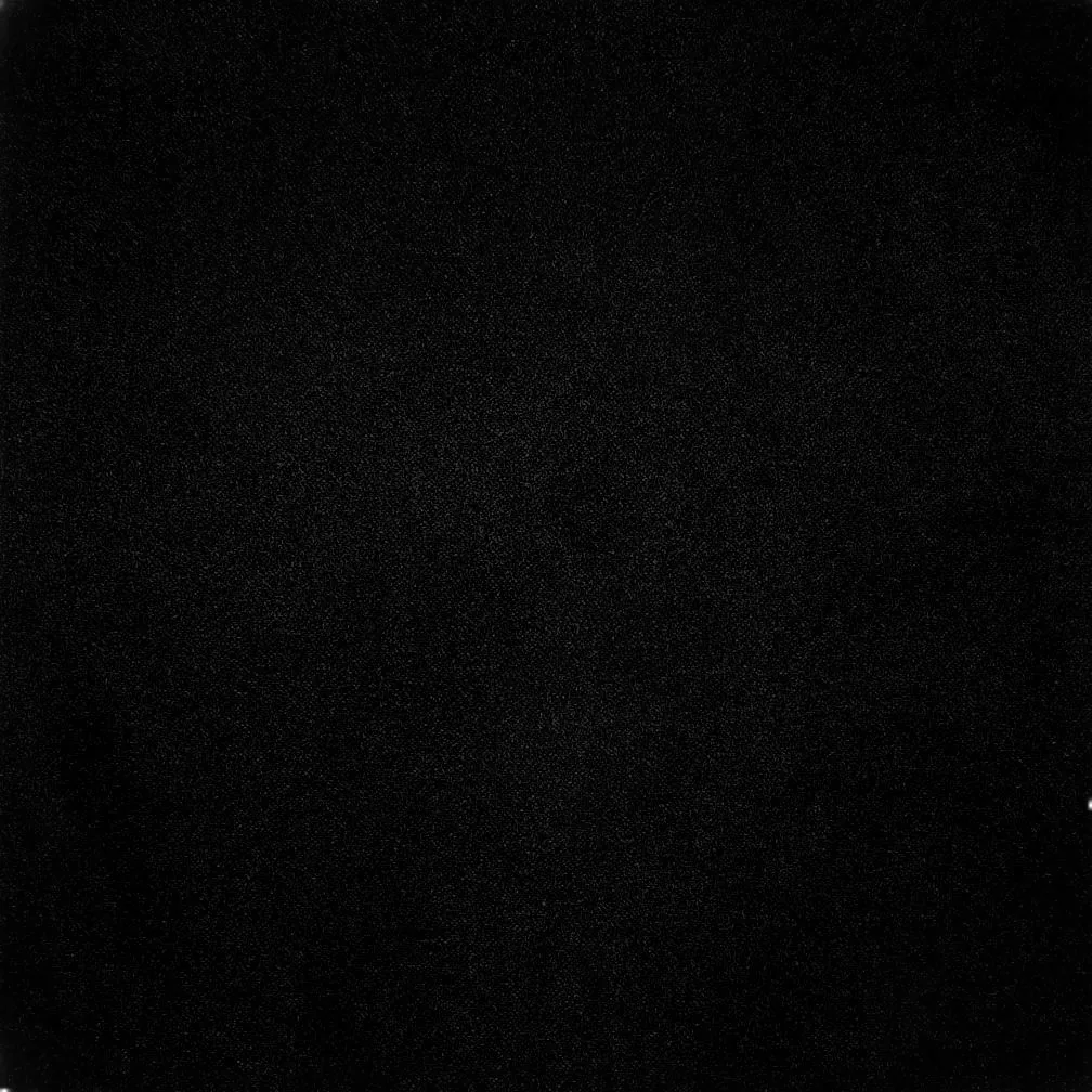 A square of near true black with the faintest film grain, no highlight anywhere — built for OLED panels.