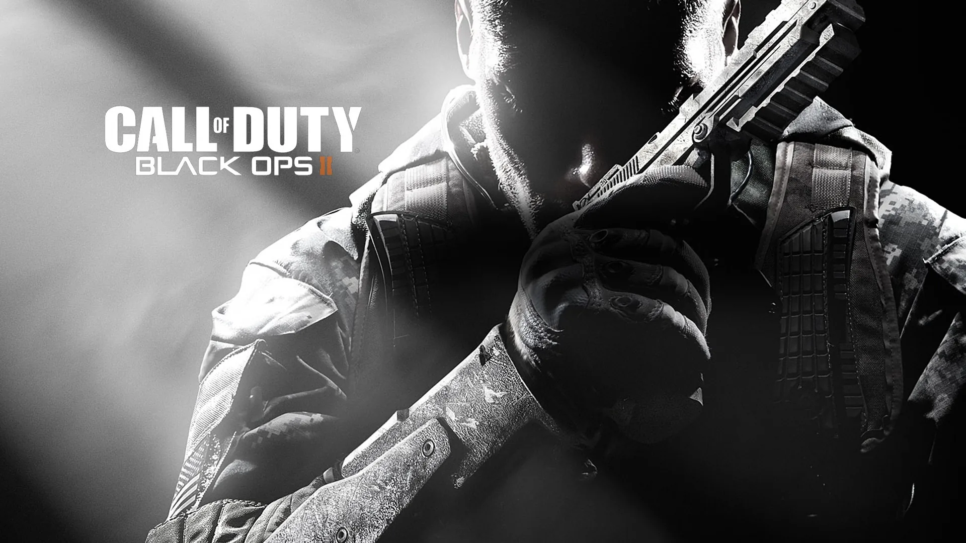Key art for Call of Duty Black Ops 2 — a soldier raises a pistol beside the stacked white logo, faces kept in shadow under a grey sky.