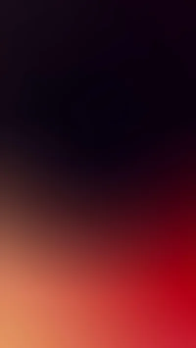 A soft gradient runs from near-black purple at the top down to warm red and orange, blurred with no hard edge anywhere.