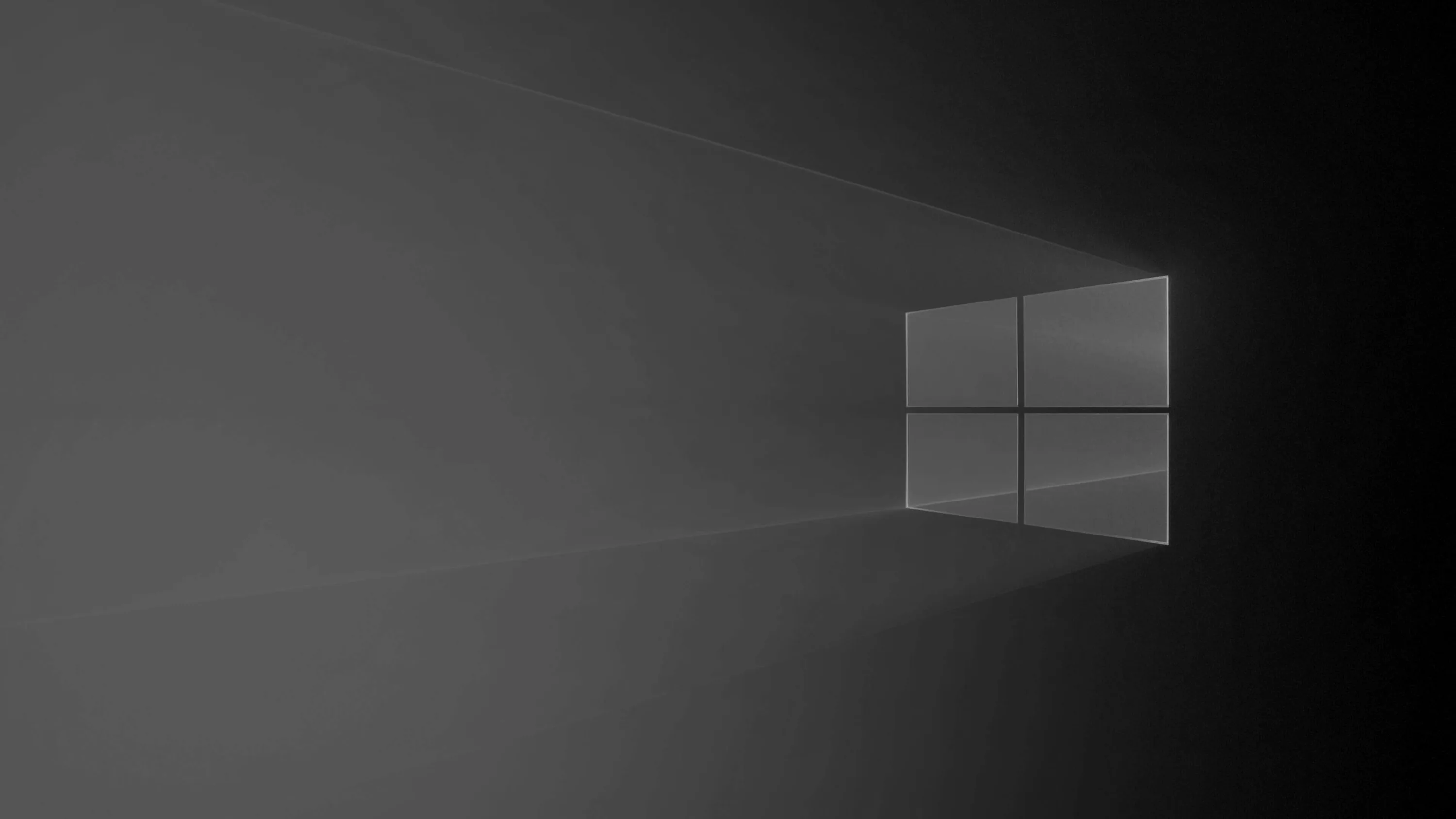 A pale window outline stands against a grey wall with light beams stretching away to the left.