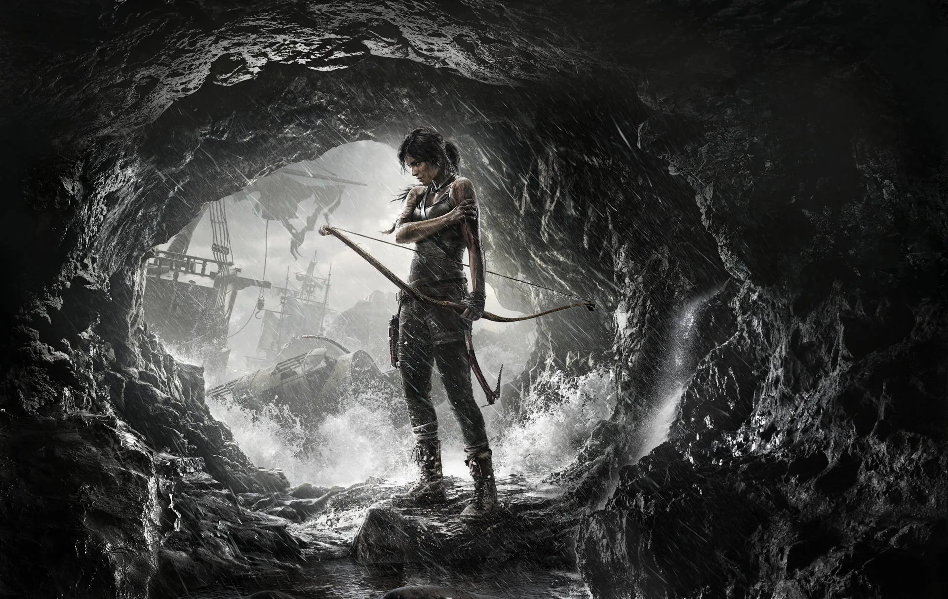 Lara Croft grips her bow in the ragged opening of a cave, a wrecked ship and stormy shore behind her in flat monochrome.