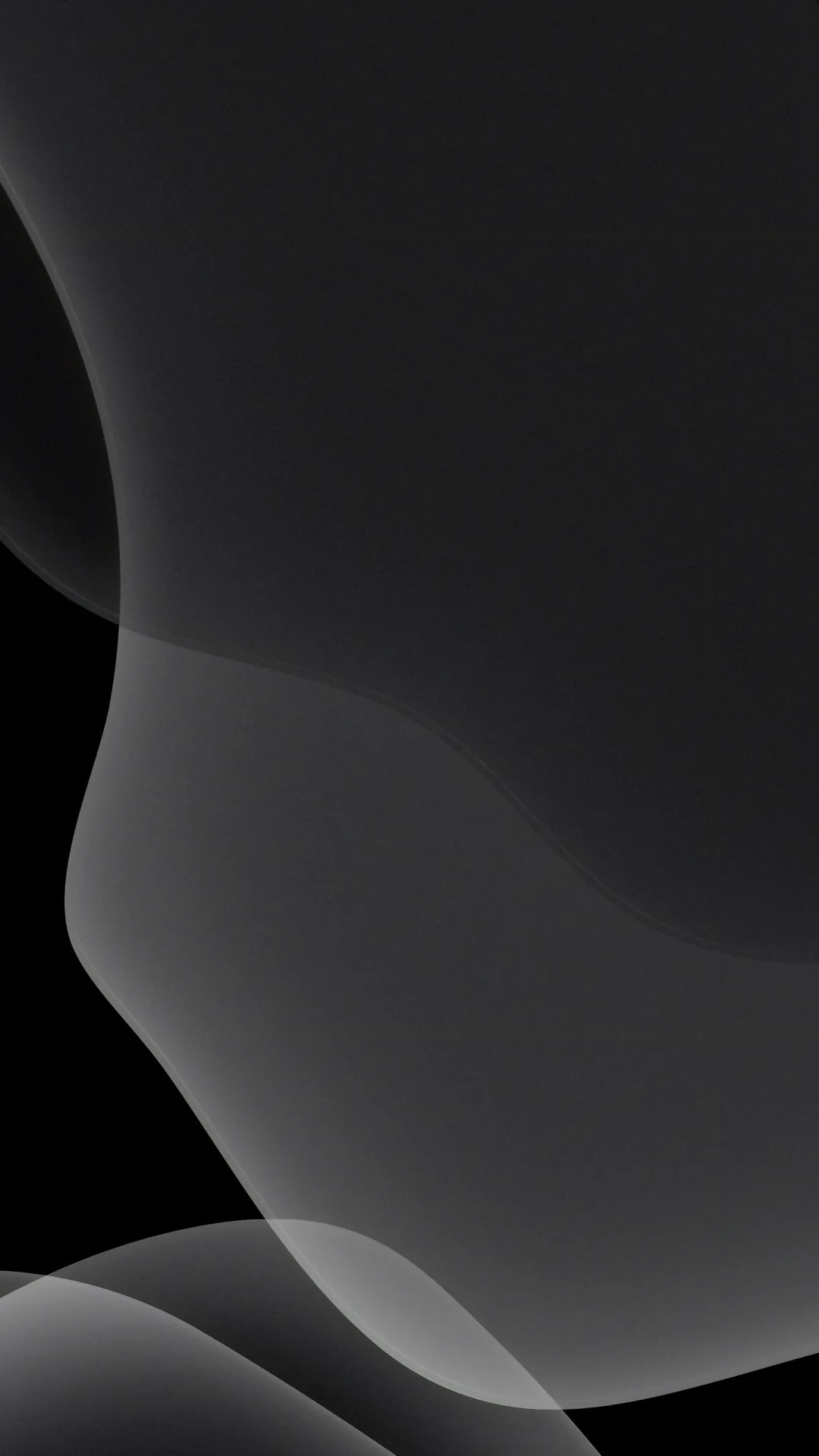 Wide grey curves swell out of the black and cross the lower half, the top left corner holding the deepest shadow in the frame.
