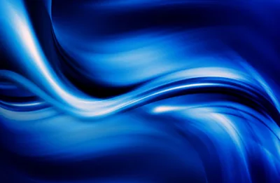 Long strokes of royal blue sweep across the frame like brushed silk, white highlights running through the curves and darkness banking at the edges.