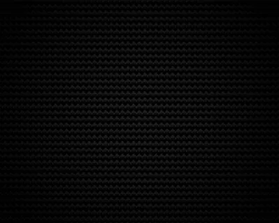 Fine zigzag rows weave across the whole frame like carbon fibre, a faint sheen at dead centre while all four corners drop to black.