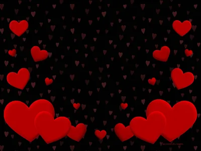 Bright red hearts of varying size drift across a black field, gathering into clusters in the two bottom corners with faint smaller ones between.