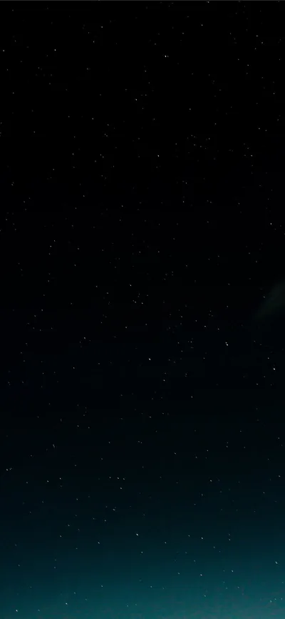 Scattered stars across near-black at the top, the sky warming into deep teal toward the bottom edge with no horizon in sight.