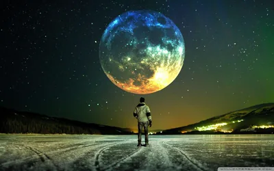 A figure stands on a frozen, tyre-tracked road beneath a giant teal-and-orange moon, distant city lights glowing along the right horizon.