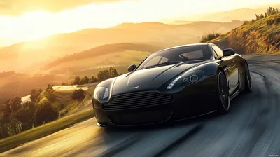 The coupe corners on a two-lane road as the sun drops behind rolling hills, warm haze washing over the valley and the black paint holding a hard rim of light.