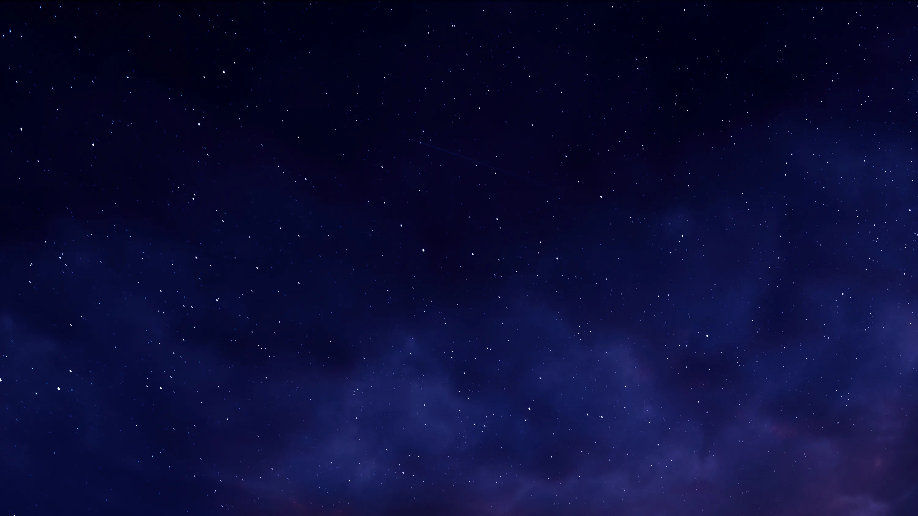 A thin scatter of stars over deep indigo, with a faint cloud bank rising from the lower right — the upper half stays clear for icons.