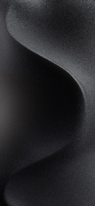 A slow S-curve of grey passes through a heavily grained charcoal field, its edges soft enough to read as fabric rather than a hard shape.