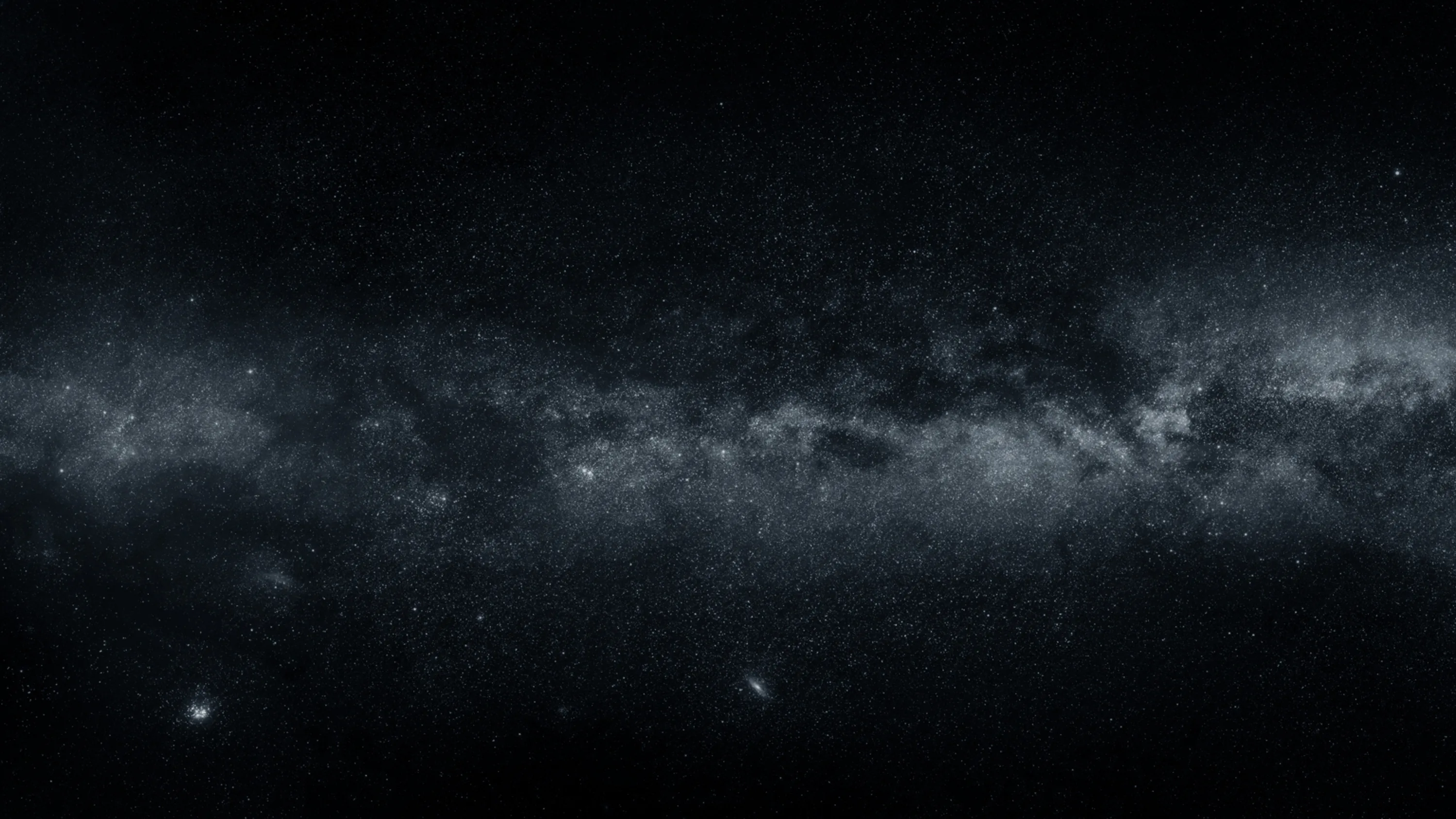 The galactic band stretches flat across the middle of the frame in cool grey, with two small satellite smudges low on the left and the top third left almost empty.