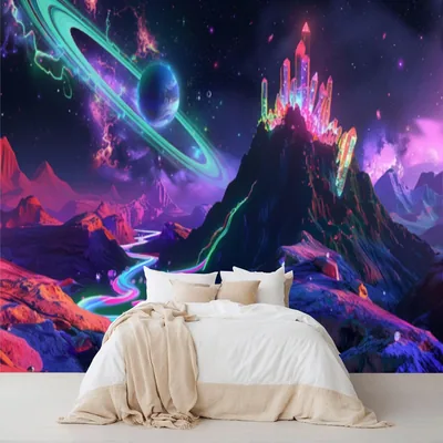 A peel-and-stick mural of a crystal mountain, ringed planet and winding neon river glowing over a white bed, shown as a full room mockup.