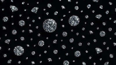 Cut stones of varying size float across a black field, each throwing its own small burst of white sparkle.