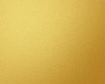 A flat, even mustard-gold surface with no pattern at all — a clean matte backdrop that keeps every icon and widget readable.