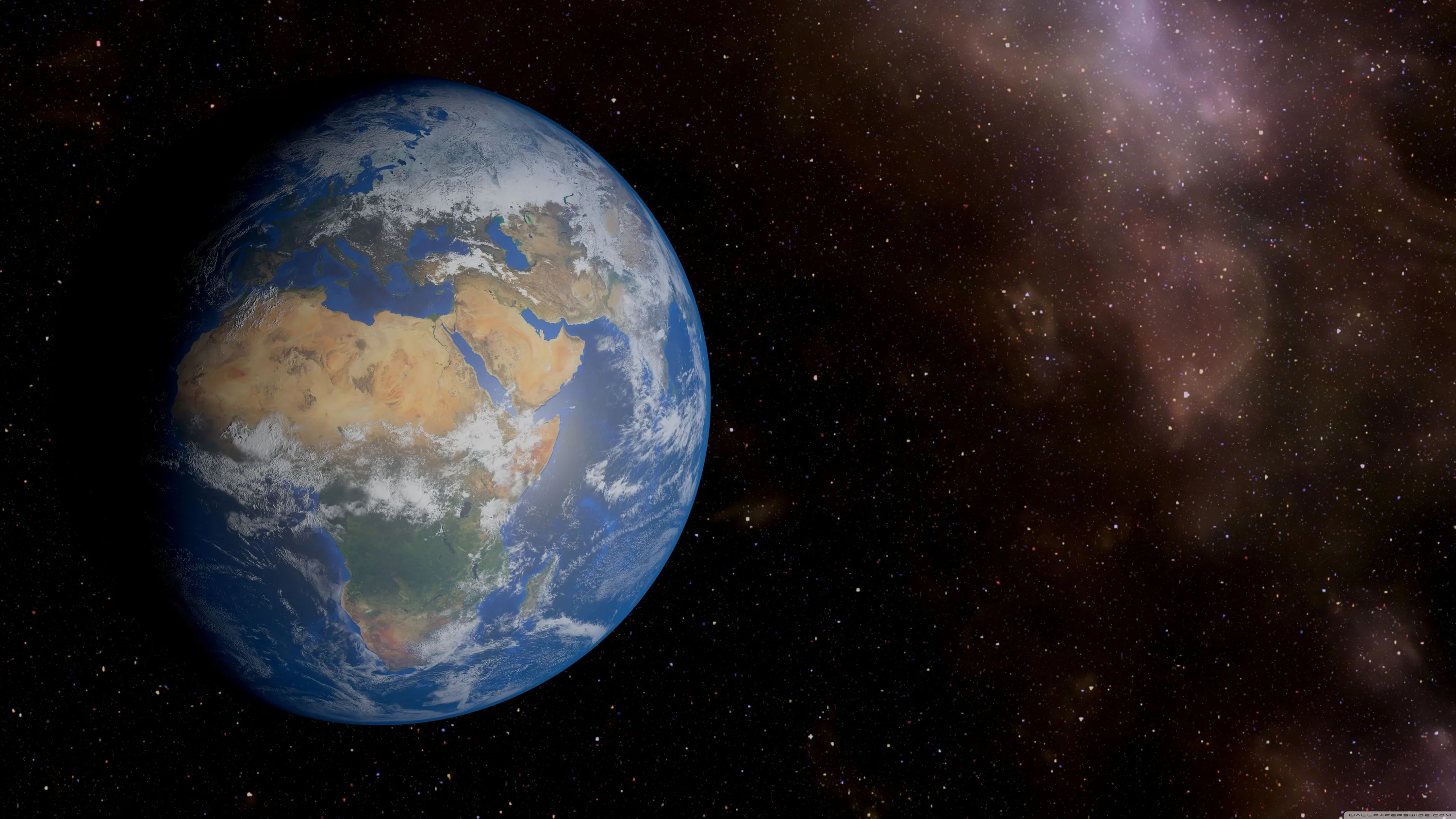 The globe sits left of centre showing Africa under sparse cloud, a brown dust nebula smudging the right half of the star field.