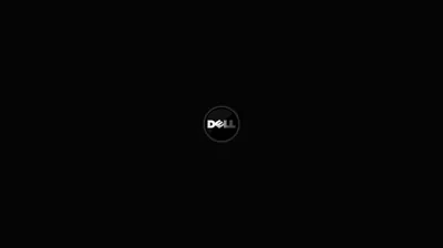 A small circular logo sits alone at the centre of an otherwise completely black screen.
