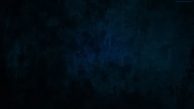 A worn navy surface covered in scratches and blotches, faintly lit toward the upper left and sinking to near-black around every border.