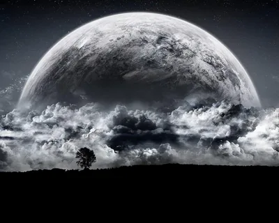 A huge moon dome climbs from behind a bank of grey storm clouds, one bare tree on the black ridge below, the whole scene in monochrome.