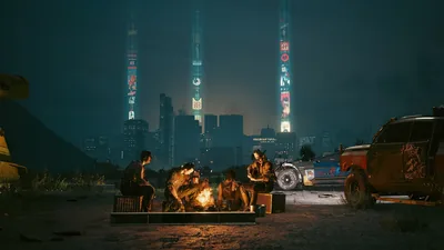 A crew gathers round a small fire in the badlands at night, corporate towers glowing on the horizon and the sky left dark for icons.