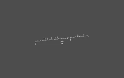 A thin white script line with a tiny heart sits just below centre on a plain charcoal grey ground, all four corners empty.