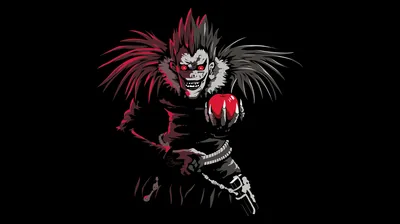 The grinning shinigami from Death Note leans forward out of pure black, spiked feathered hair and a red apple the only colour in the frame.